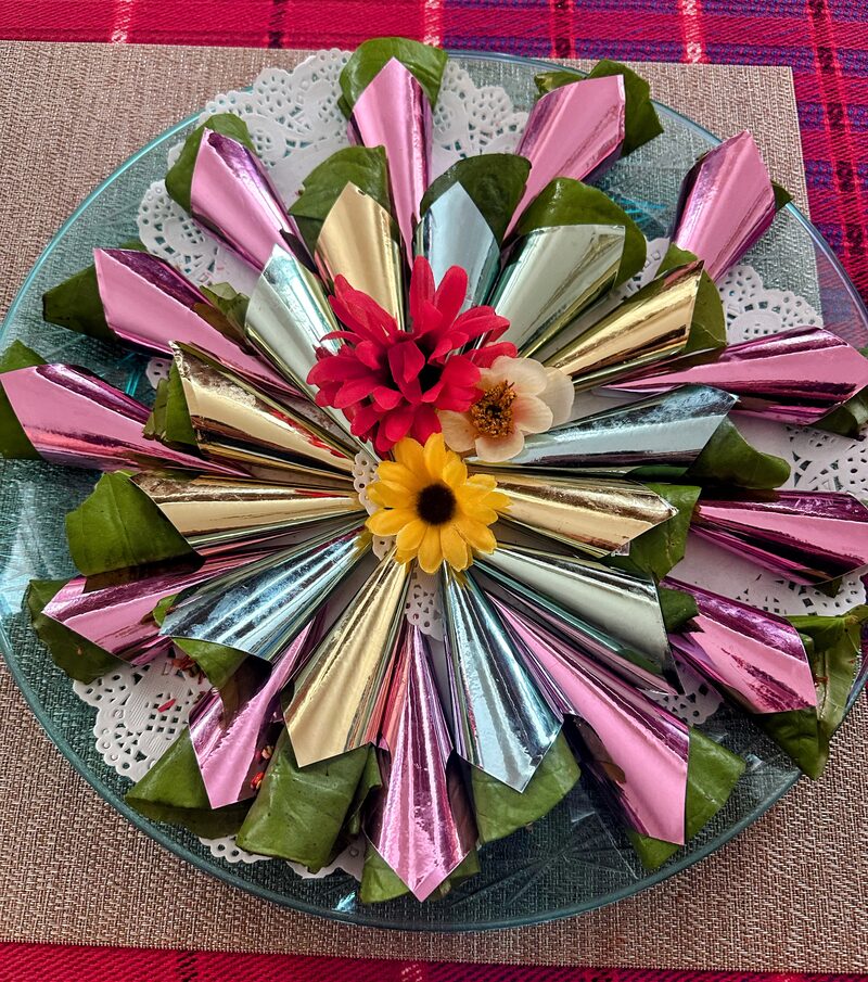 Soft pastel paan tray with fresh flowers